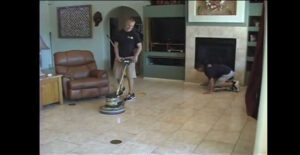 Technician from Arizona Tile and Grout Care polishing tile floor in a Tucson home.