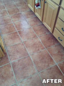 Red-toned ceramic floor tiles with visible grime—after tile cleaning service in Tucson.