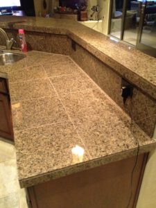 Polished granite countertop in kitchen—granite surface cleaning in Tucson by Arizona Tile and Grout Care.