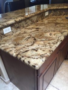 Beige and brown granite kitchen counter—granite polishing and sealing Tucson services.