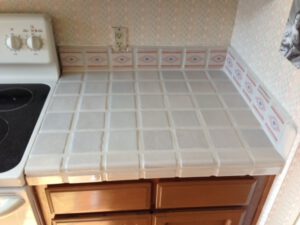 Before image of ceramic countertop tile cleaning service in Tucson by Arizona Tile & Grout Care.