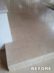 High-gloss tile floor reflecting vanity lights—tile polishing services in Tucson.