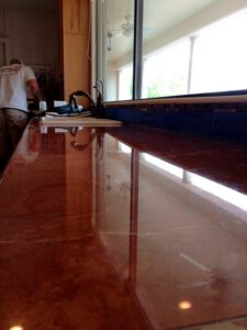 Glossy marble floor after professional tile cleaning and sealing in Tucson, Arizona.