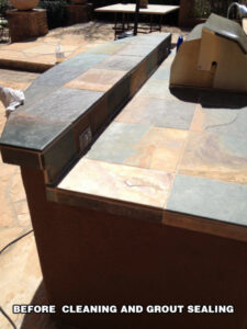 Close-up of slate countertop with visible grout lines—Tucson slate tile care and sealing services.