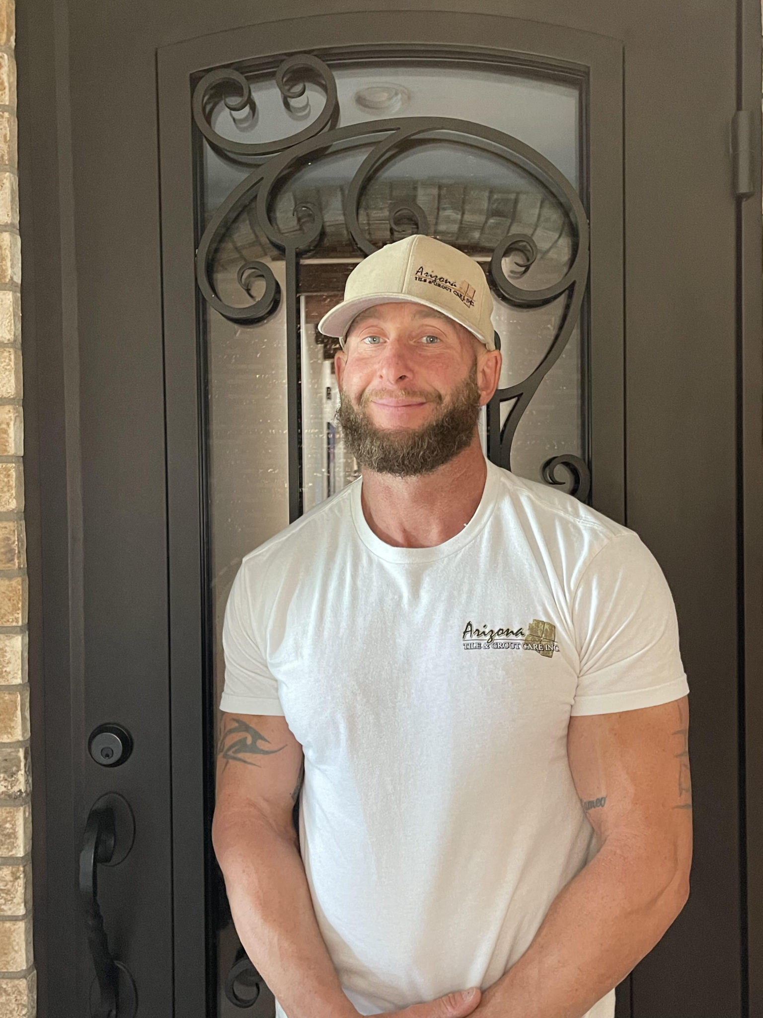 Smiling team member at Arizona Tile and Grout Care, ready to assist customers.