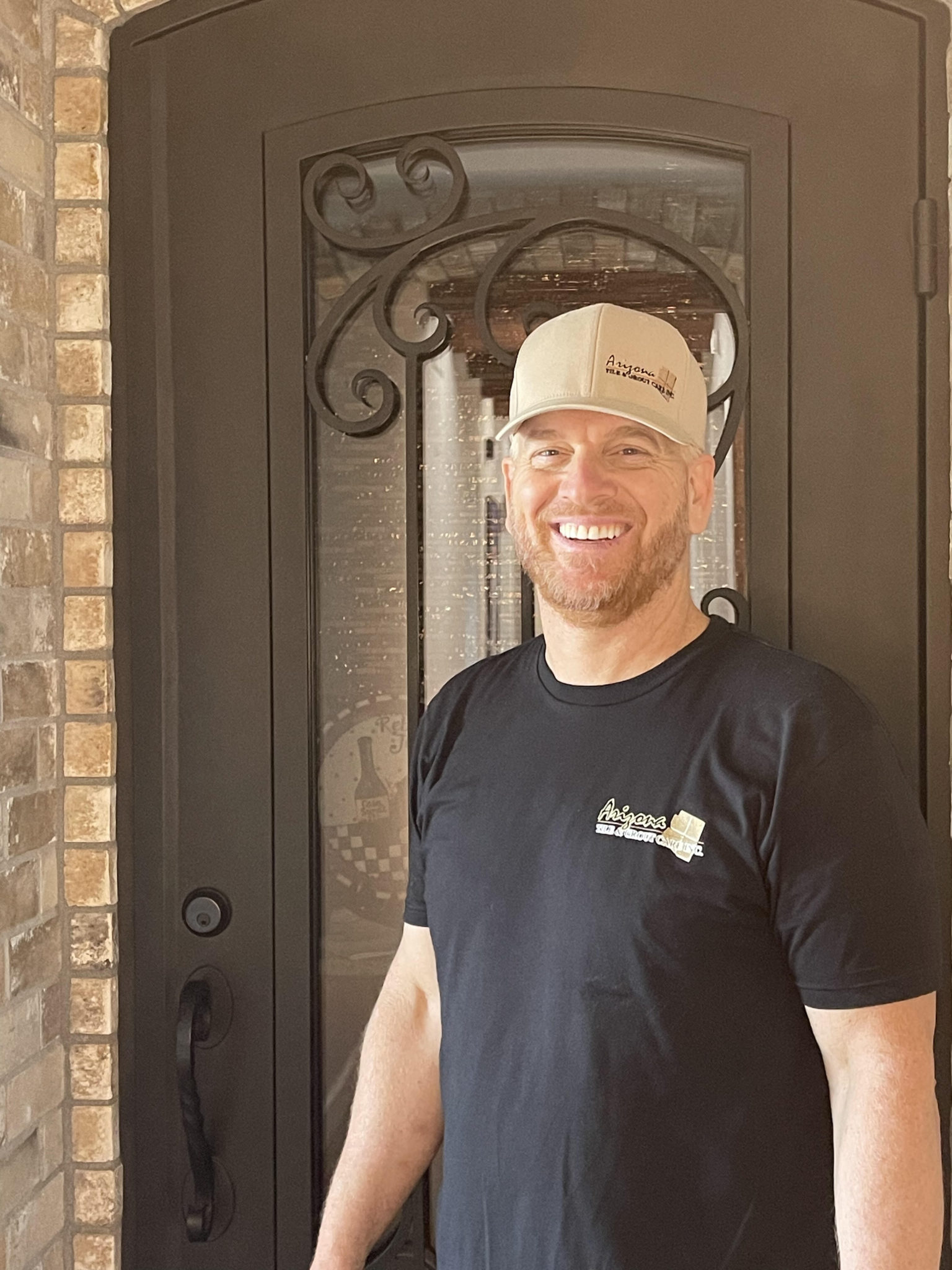 Professional staff member in uniform, providing top-rated tile cleaning service.