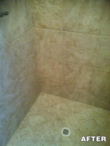 Close-up of shower wall tile with discoloration—tile and grout cleaning in Tucson by Arizona Tile and Grout Care.